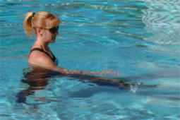 Photo of a woman exercising in a pool