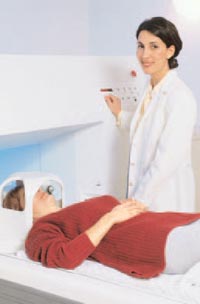 Photo of a woman gettin a MRI Scan