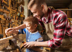Photo of a man & child with tools