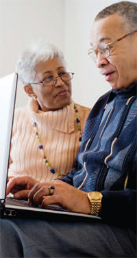Photo of an elderly couple on a laptop