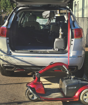 Photo of a lift used to put a scooter in the back of a van