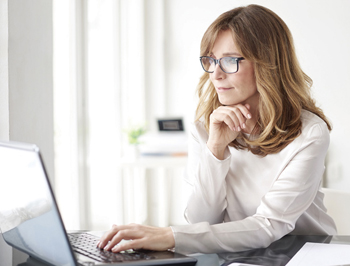 Photo of a woman on a computer