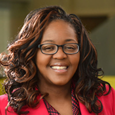 Photo of Dr. Yolanda Wheeler wearing glasses and red blazer for Successful Travel with MS webinar