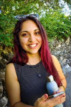 Headshot of artist with MS Hannah Garrison, instructor for Improving Lives Through Art, holding a water bottle outside