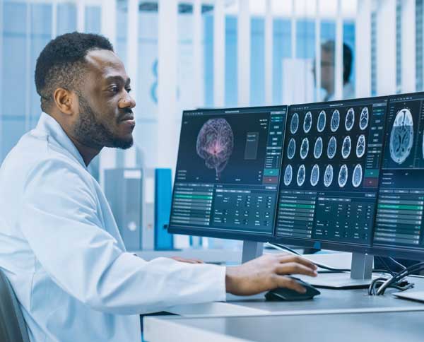 MRI technician Man reading MRI scans