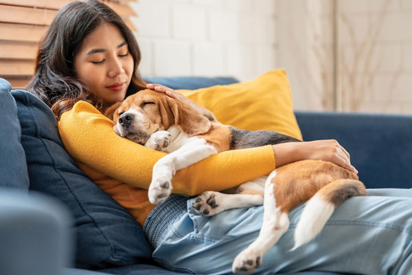 Woman hugging dog